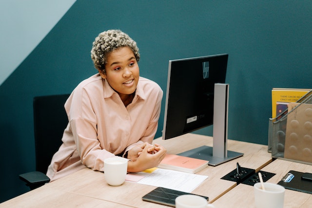 Photo by cottonbro studio: https://www.pexels.com/photo/a-woman-sitting-at-her-work-desk-5990040/